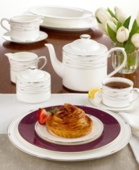 Set a sumptuous table with luxurious Precious Platinum dinnerware and dishes from Royal Doulton. Intertwining platinum lines and raised, dotted accents create a sophisticated, segmented design. Coco accent plate shown back. Blue Accent plate cannot be returned to stores. White rimmed plate (shown front) is the Precious Platinum Collection salad plate.