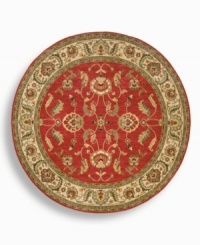 A larger-diameter round that is ideal for oversized rooms, this classic Agra rug features a scrolling vine design of oversized palmettes and serrated leaves. The green and ivory tones in the palmette border perfectly complement the dynamic color shadings of the rich red ground. Special color treatment creates a gentle finish. Woven of premium worsted New Zealand wool for indulgent softness. A larger-diameter round that is ideal for oversized rooms, this classic Agra rug features a scrolling vine design of oversized palmettes and serrated leaves. The green and ivory tones in the palmette border perfectly complement the dynamic color shadings of the rich red ground. Special color treatment creates a gentle finish. Woven of premium worsted New Zealand wool for indulgent softness.