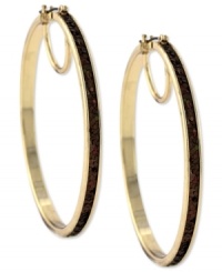 Hit the right notes with these hoop earrings from Jessica Simpson. Crafted from gold tone mixed metal, they also shine with a topaz-colored glitter. Approximate drop: 2-1/2 inches. Approximate diameter: 2-1/2 inches. Hit the right notes with these hoop earrings from Jessica Simpson. Crafted from gold tone mixed metal, they also shine with a topaz-colored glitter. Approximate drop: 2-1/2 inches. Approximate diameter: 2-1/2 inches.