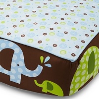 Playful blue and green elephants on a brown ground with a coordinating blue, green and brown pinwheel-like print, separated by brown linen piping.The American Academy of Pediatrics and the U.S. Consumer Product Safety Commission have made recommendations for safe bedding practices for babies. When putting infants under 12 months to sleep, remove pillows, quilts, comforters, and other soft items from the crib.