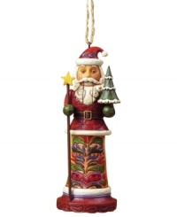 Jim Shore cracks the code on Christmas with an ornament that combines two holiday classics – St. Nick and a nutcracker! Featuring an ornately carved and patterned coat, star-topped staff and tiny tree. Jim Shore cracks the code on Christmas with an ornament that combines two holiday classics – St. Nick and a nutcracker! Featuring an ornately carved and patterned coat, star-topped staff and tiny tree.