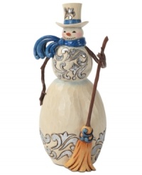 Brilliant blue details light up this folksy snowman. With broom in hand and windswept scarf around his neck, this figurine adds new personality to the season. Brilliant blue details light up this folksy snowman. With broom in hand and windswept scarf around his neck, this figurine adds new personality to the season.