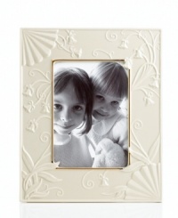 Lenox combines ivory porcelain sculpted with graceful blooms, elegant fluting and touches of gold in the classically styled Floral Melody picture frame. Lenox combines ivory porcelain sculpted with graceful blooms, elegant fluting and touches of gold in the classically styled Floral Melody picture frame.