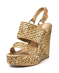Lightly distressed raffia is trimmed in luxe leather on a silhouette that's sure to make a summer statement. From Jean-Michel Cazabat. Lightly distressed raffia is trimmed in luxe leather on a silhouette that's sure to make a summer statement. From Jean-Michel Cazabat.