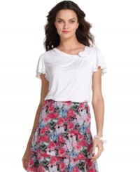 A drapey fit, flutter sleeves and a rosette embellishment combine on this petite top by Elementz. Pair with brightly printed skirts or dark denim and colorful flats for an ensemble in a snap. A drapey fit, flutter sleeves and a rosette embellishment combine on this petite top by Elementz. Pair with brightly printed skirts or dark denim and colorful flats for an ensemble in a snap.