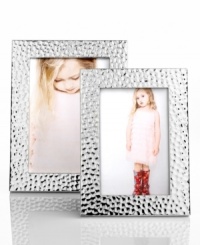 Shine on. This Martha Stewart Collection picture frame is positively radiant in hammered silver plate to complement any setting. Shine on. This Martha Stewart Collection picture frame is positively radiant in hammered silver plate to complement any setting.