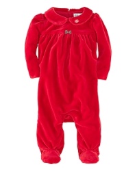 A beautiful long-sleeved footie in plush velour is highlighted with pretty puffed sleeves and an empire waist. A beautiful long-sleeved footie in plush velour is highlighted with pretty puffed sleeves and an empire waist.