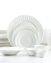 From soup to nuts, this Gibson white dinnerware set has all the pieces you need to plate and enjoy every meal. White porcelain stands up to daily use but, with classic fluting and beaded trim, is elegant enough for entertaining, too. From soup to nuts, this Gibson white dinnerware set has all the pieces you need to plate and enjoy every meal. White porcelain stands up to daily use but, with classic fluting and beaded trim, is elegant enough for entertaining, too.
