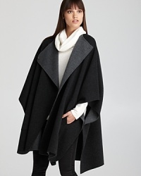 Modern, sophisticated and cool, this voluminous Vince cape delivers laid-back luxury. Modern, sophisticated and cool, this voluminous Vince cape delivers laid-back luxury.