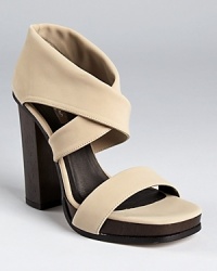 Stretchy matte fabric makes a modern-minimalist statement on Calvin Klein Collection's Fiana sandals. Stretchy matte fabric makes a modern-minimalist statement on Calvin Klein Collection's Fiana sandals.