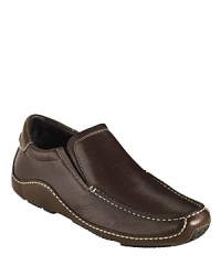 Cole Haan's Nike Air™ Ryder is a casual slip-on with a low profile, contrast stitching and tire-inspired tread, as well as the comfort and support of Nike Air™ technology in the heel. Cole Haan's Nike Air™ Ryder is a casual slip-on with a low profile, contrast stitching and tire-inspired tread, as well as the comfort and support of Nike Air™ technology in the heel.