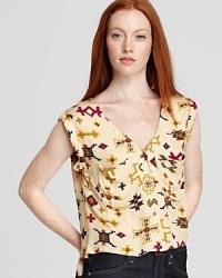 A vibrant tribal print adorns this sleeveless earthy-chic top cut with a drapey silhouette. Suiting-inspired details include chest pockets and a deep V-neck. A vibrant tribal print adorns this sleeveless earthy-chic top cut with a drapey silhouette. Suiting-inspired details include chest pockets and a deep V-neck.