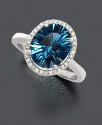Absolutely mesmerizing. Add a hint of sparkle with oval-cut concave London blue topaz (4 ct. t.w.) embellished with a ring of round-cut diamonds (1/8 ct. t.w.). Set in 14k white gold. Absolutely mesmerizing. Add a hint of sparkle with oval-cut concave London blue topaz (4 ct. t.w.) embellished with a ring of round-cut diamonds (1/8 ct. t.w.). Set in 14k white gold.
