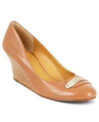 Drop hints of style everywhere you step. Nine West's Getablue wedge pumps are decorated with a metallic accent that stretches across the vamp. Drop hints of style everywhere you step. Nine West's Getablue wedge pumps are decorated with a metallic accent that stretches across the vamp.