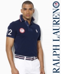 A trim-fitting short-sleeved polo shirt is rendered in breathable cotton mesh with bold country embroidery, celebrating Team USA's participation in the 2012 Paralympic Games. A trim-fitting short-sleeved polo shirt is rendered in breathable cotton mesh with bold country embroidery, celebrating Team USA's participation in the 2012 Paralympic Games.