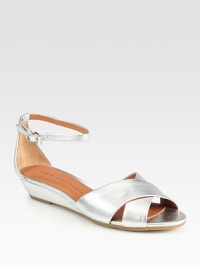 A comfortable mini wedge subtly lifts this crisscrossed metallic leather silhouette with an adjustable ankle strap. Self-covered wedge, 1¼ (30mm)Metallic leather upperAdjustable ankle strapLeather liningRubber solePadded insoleImported A comfortable mini wedge subtly lifts this crisscrossed metallic leather silhouette with an adjustable ankle strap. Self-covered wedge, 1¼ (30mm)Metallic leather upperAdjustable ankle strapLeather liningRubber solePadded insoleImported