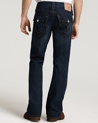 True Religion's bootcut, low rise jeans with signature horseshoes pocket styling and whiskering details in an indigo wash. True Religion's bootcut, low rise jeans with signature horseshoes pocket styling and whiskering details in an indigo wash.
