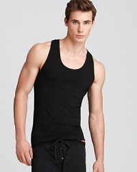 Because it grips the body for a smooth, streamlined look, this tank boasts masculine appeal to complement your build. Because it grips the body for a smooth, streamlined look, this tank boasts masculine appeal to complement your build.
