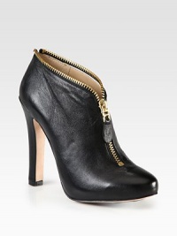 Edgy metal zip-trim adds some kick to this classic leather silhouette. Self-covered heel, 5¾ (145mm)Hidden platform, ½ (15mm)Compares to a 5¼ heel (130mm)Leather upper with zipper trimFront zipLeather liningLeather and rubber solePadded insoleImportedOUR FIT MODEL RECOMMENDS ordering one half size down as this style runs large. Edgy metal zip-trim adds some kick to this classic leather silhouette. Self-covered heel, 5¾ (145mm)Hidden platform, ½ (15mm)Compares to a 5¼ heel (130mm)Leather upper with zipper trimFront zipLeather liningLeather and rubber solePadded insoleImportedOUR FIT MODEL RECOMMENDS ordering one half size down as this style runs large.