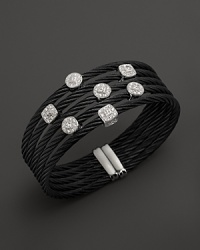 Diamonds set in white gold on a stainless steel and black PVD bangle. By Charriol. Diamonds set in white gold on a stainless steel and black PVD bangle. By Charriol.
