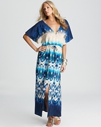 Make a bohemian beachwear statement with this printed caftan from ViX. Its dramatic design and drape perfects '70's chic with an armful of bangles and oversized frames. Make a bohemian beachwear statement with this printed caftan from ViX. Its dramatic design and drape perfects '70's chic with an armful of bangles and oversized frames.
