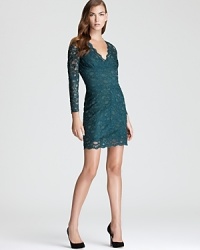 Sheer lace lends an alluring look to this feminine Nicole Miller dress. Sheer lace lends an alluring look to this feminine Nicole Miller dress.