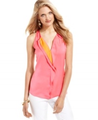 A fluttery ruffle offers up a pop of color on a T Tahari's silky sleeveless blouse. Try it with white jeans for a breezy feel that's perfect for the season. A fluttery ruffle offers up a pop of color on a T Tahari's silky sleeveless blouse. Try it with white jeans for a breezy feel that's perfect for the season.