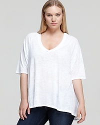 A contemporary spin on the classic white tee, this Nation LTD Plus top flaunts a dramatic high/low hem and a chic burnout print for real modern edge. A contemporary spin on the classic white tee, this Nation LTD Plus top flaunts a dramatic high/low hem and a chic burnout print for real modern edge.