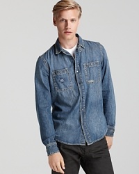 Diesel's chambray button-up shirt boasts perennial cool. Diesel's chambray button-up shirt boasts perennial cool.