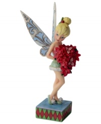 Clap your hands! Holding a bright batch of poinsettias, Tinkerbell makes an unforgettable Christmas debut. This precious fairy flutters airy wings that are emblazoned with a delicate, floral-inspired design. Clap your hands! Holding a bright batch of poinsettias, Tinkerbell makes an unforgettable Christmas debut. This precious fairy flutters airy wings that are emblazoned with a delicate, floral-inspired design.