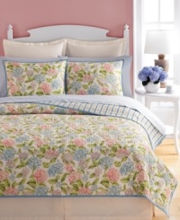 Fancy florals. Martha Stewart Collection's Hydrangea quilt features blooming flowers in an array of pink, purple and blue hues for a look full of nature-inspired charm. Finished with allover quilting details for plush texture. Reverses to a stripe pattern. Fancy florals. Martha Stewart Collection's Hydrangea quilt features blooming flowers in an array of pink, purple and blue hues for a look full of nature-inspired charm. Finished with allover quilting details for plush texture. Reverses to a stripe pattern.