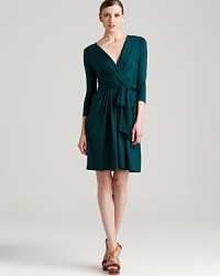 Carry off the ladylike statement without saccharine girlieness in this DKNY dress. A lush jewel tone enlivens a fit-and-flare silhouette for a classic feminine statement. Carry off the ladylike statement without saccharine girlieness in this DKNY dress. A lush jewel tone enlivens a fit-and-flare silhouette for a classic feminine statement.