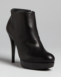 Seeking the perfect work-to-play platform booties? Zip into this Stuart Weitzman design. Seeking the perfect work-to-play platform booties? Zip into this Stuart Weitzman design.