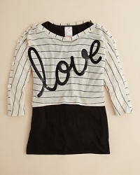 We love the 80s glamour of Kiddo's cute cropped top, layered over a longer solid undershirt. We love the 80s glamour of Kiddo's cute cropped top, layered over a longer solid undershirt.