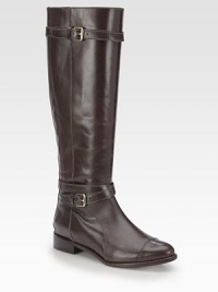 Timeless smooth leather design with wrap-around buckle straps and a convenient back zip. Stacked heel, 1¼ (30mm)Shaft, 16Leg circumference, 13Leather upperBack zip and adjustable buckle strapsLeather lining and solePadded insoleImported Timeless smooth leather design with wrap-around buckle straps and a convenient back zip. Stacked heel, 1¼ (30mm)Shaft, 16Leg circumference, 13Leather upperBack zip and adjustable buckle strapsLeather lining and solePadded insoleImported