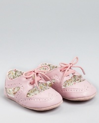 Somewhere between a sneaker and a sandal lies this adorable wing tip-inspired sneaker from Juicy Couture. The cute cut-outs reveal the floral lining. Somewhere between a sneaker and a sandal lies this adorable wing tip-inspired sneaker from Juicy Couture. The cute cut-outs reveal the floral lining.