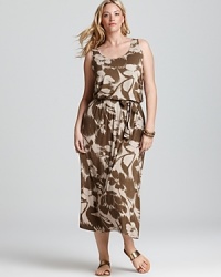 Camouflage goes chic as this MICHAEL Michael Kors Plus maxi dress plays up a natural color palette with an oversized floral print. Garnish with gold accents for 24-7 style. Camouflage goes chic as this MICHAEL Michael Kors Plus maxi dress plays up a natural color palette with an oversized floral print. Garnish with gold accents for 24-7 style.