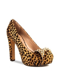 VINCE CAMUTO's Jamma platforms are not-so-sweet--a girlish bow is toughened up with spiked gold-tone studs. VINCE CAMUTO's Jamma platforms are not-so-sweet--a girlish bow is toughened up with spiked gold-tone studs.