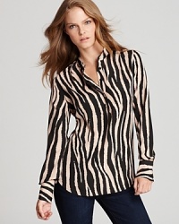 Executive style goes exotic as a statement zebra print shakes up the essential Isaac Mizrahi Jeans blouse. Effortlessly-chic dressed down with denim and impeccably polished with a crisp pencil skirt. Executive style goes exotic as a statement zebra print shakes up the essential Isaac Mizrahi Jeans blouse. Effortlessly-chic dressed down with denim and impeccably polished with a crisp pencil skirt.