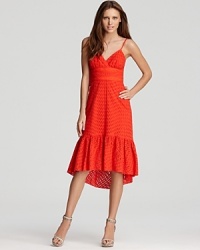 Fabulous for a fiesta or simply for a sunny day, this red Trina Turk dress marries playful eyelet with a flirty ruffle hem for a sensational, head-turning look. Fabulous for a fiesta or simply for a sunny day, this red Trina Turk dress marries playful eyelet with a flirty ruffle hem for a sensational, head-turning look.