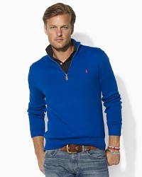 Knit from soft cotton and adorned with Ralph Lauren's signature pony, this sharp mockneck provides a stylish solution to dropping temperatures. Knit from soft cotton and adorned with Ralph Lauren's signature pony, this sharp mockneck provides a stylish solution to dropping temperatures.