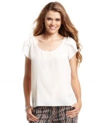 Minimalist-chic! Ruffle-adorned sleeves add a touch of girlish charm to this top from Jessica Simpson. Minimalist-chic! Ruffle-adorned sleeves add a touch of girlish charm to this top from Jessica Simpson.