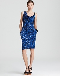 A dramatic draped front lends intrigue to this DKNY dress, finished in a graphic print for the ultimate in city-chic style. Toughen the silhouette with an edgy leather jacket. A dramatic draped front lends intrigue to this DKNY dress, finished in a graphic print for the ultimate in city-chic style. Toughen the silhouette with an edgy leather jacket.