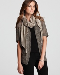 A metallic sheen and variegated stitching lend lush dimension to this Eileen Fisher cardigan. Slip on the layer for instant luxe appeal. A metallic sheen and variegated stitching lend lush dimension to this Eileen Fisher cardigan. Slip on the layer for instant luxe appeal.