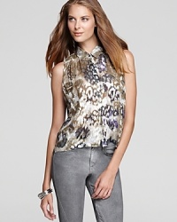 Rock the metallic trend we cheered sashaying down the runway with this new Joe's Collection top, lavished with a shiny floral print. Rock the metallic trend we cheered sashaying down the runway with this new Joe's Collection top, lavished with a shiny floral print.