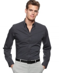 Upgrade your style with a sleek slim-fit woven shirt from Calvin Klein. Upgrade your style with a sleek slim-fit woven shirt from Calvin Klein.
