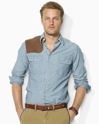 The always classic and effortlessly cool chambray workshirt becomes even more rugged with a rich indigo wash and supple suede gun patch. The always classic and effortlessly cool chambray workshirt becomes even more rugged with a rich indigo wash and supple suede gun patch.
