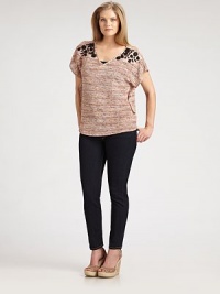 Enhanced by shiny stones, this textured v-neck design offers a relaxed-yet-flattering fit and instant appeal.V-necklineShort sleevesGlossy stone shoulder detailsPull-on styleAbout 30 from shoulder to hemRaschelDry cleanMade in USA Enhanced by shiny stones, this textured v-neck design offers a relaxed-yet-flattering fit and instant appeal.V-necklineShort sleevesGlossy stone shoulder detailsPull-on styleAbout 30 from shoulder to hemRaschelDry cleanMade in USA
