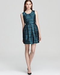 A jacquard pattern shines in a metallic finish on this sleeveless Shoshanna dress, the perfect party dress for any season. A jacquard pattern shines in a metallic finish on this sleeveless Shoshanna dress, the perfect party dress for any season.