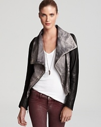Embrace the versatile nature of this uber-stylish leather Doma jacket that features contrast sleeves that may be detached, converting this edgy-modern jacket to a chic zip-front vest. Embrace the versatile nature of this uber-stylish leather Doma jacket that features contrast sleeves that may be detached, converting this edgy-modern jacket to a chic zip-front vest.